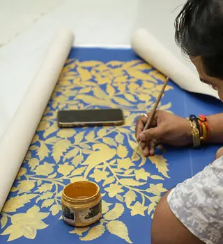 Textile design lab session at a leading design school in India with students practicing traditional fabric printing
