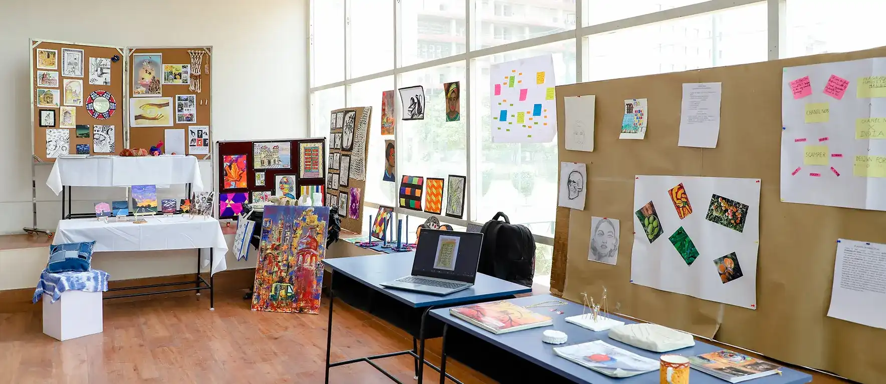 Creative mood board and student workspace featuring fashion sketches, textile samples, and digital design tools at top design schools in India