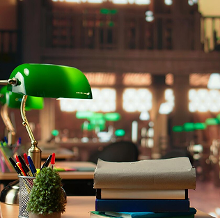 Green desk lamp on a campus study table